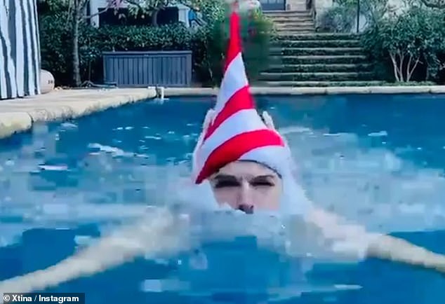 Chrismas diving: she included a video of her husband doing laps in their pool, dipping his hat underwater, with fake white beard and elf ears